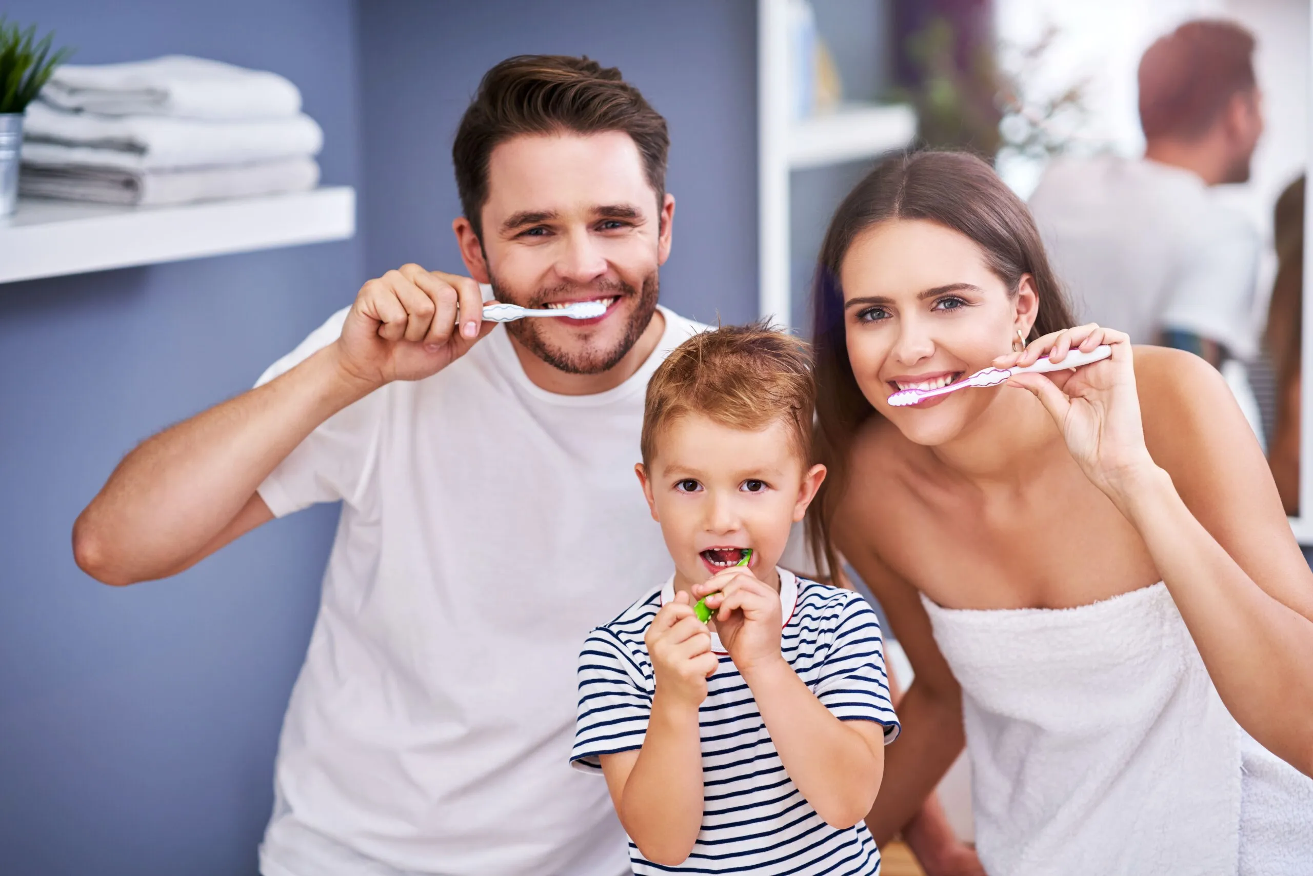 portrait of happy family brushing teeth