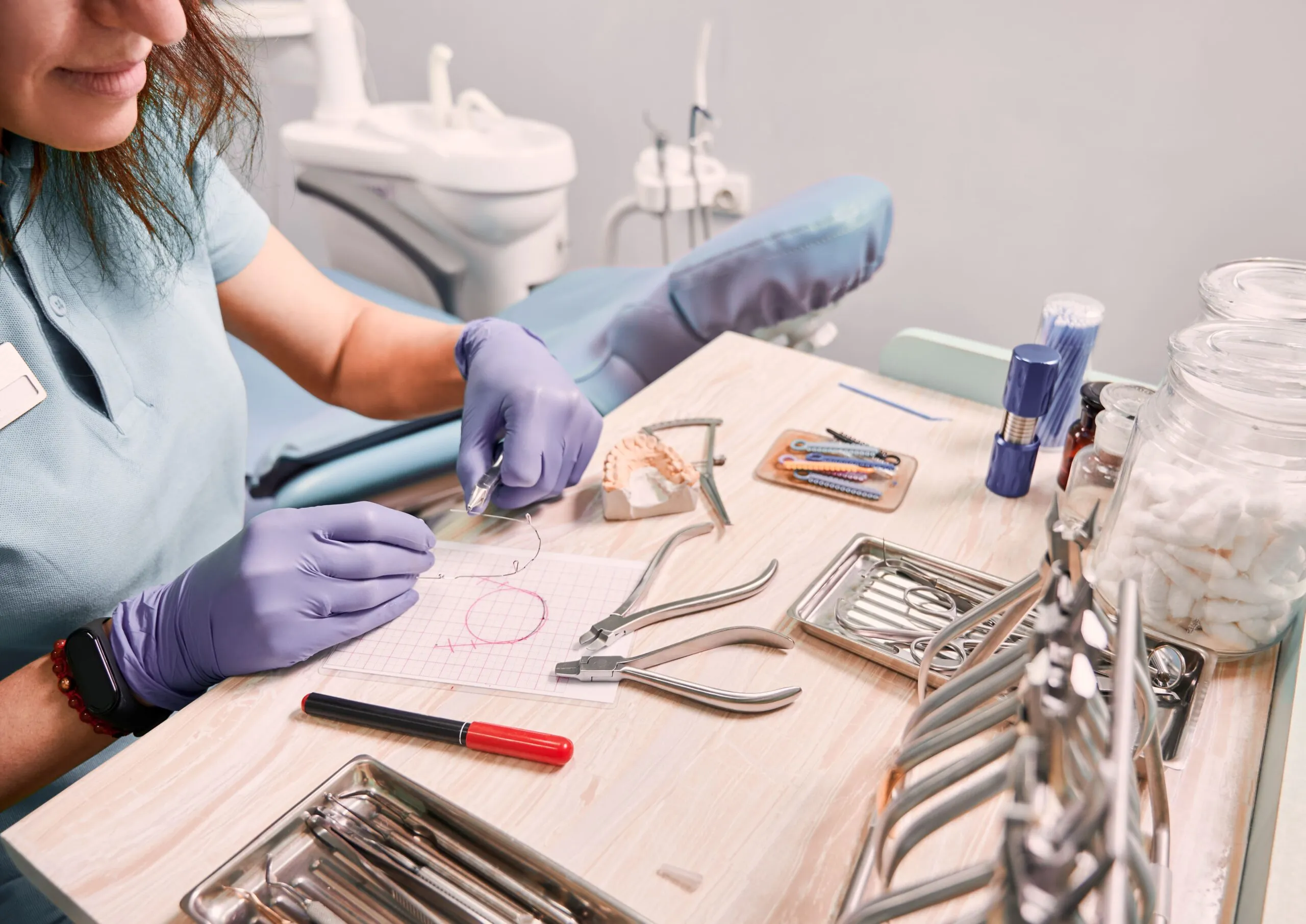 female orthodontist working in dental office