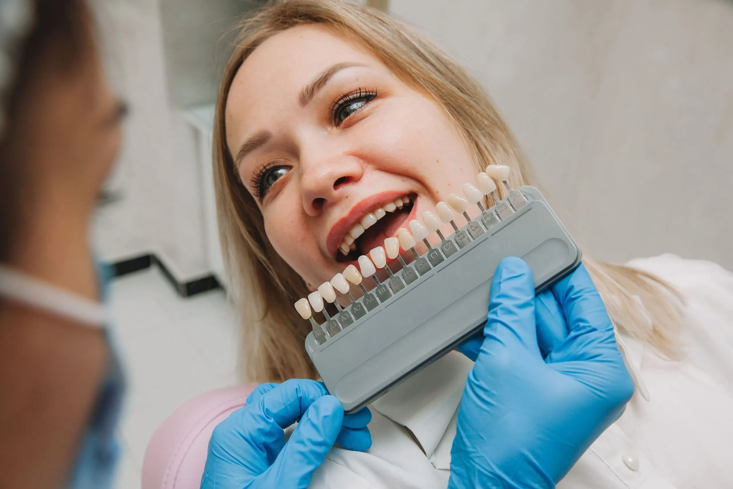 the girl in the dentist office selects the color